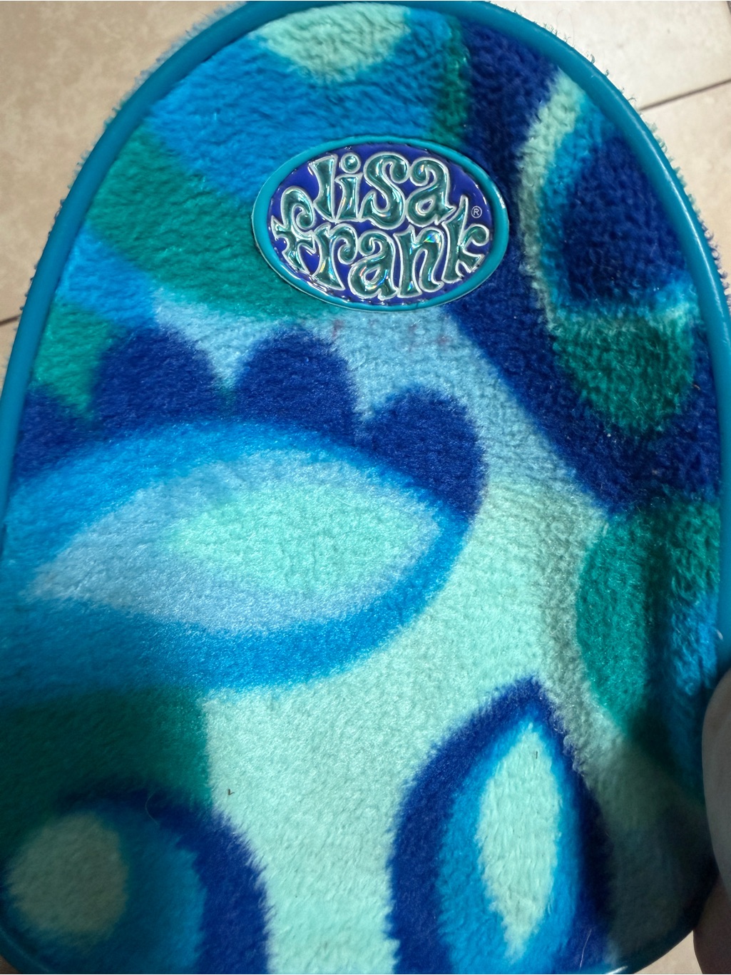 Vintage Lisa Frank backpack listed for resale, rainbow animal print